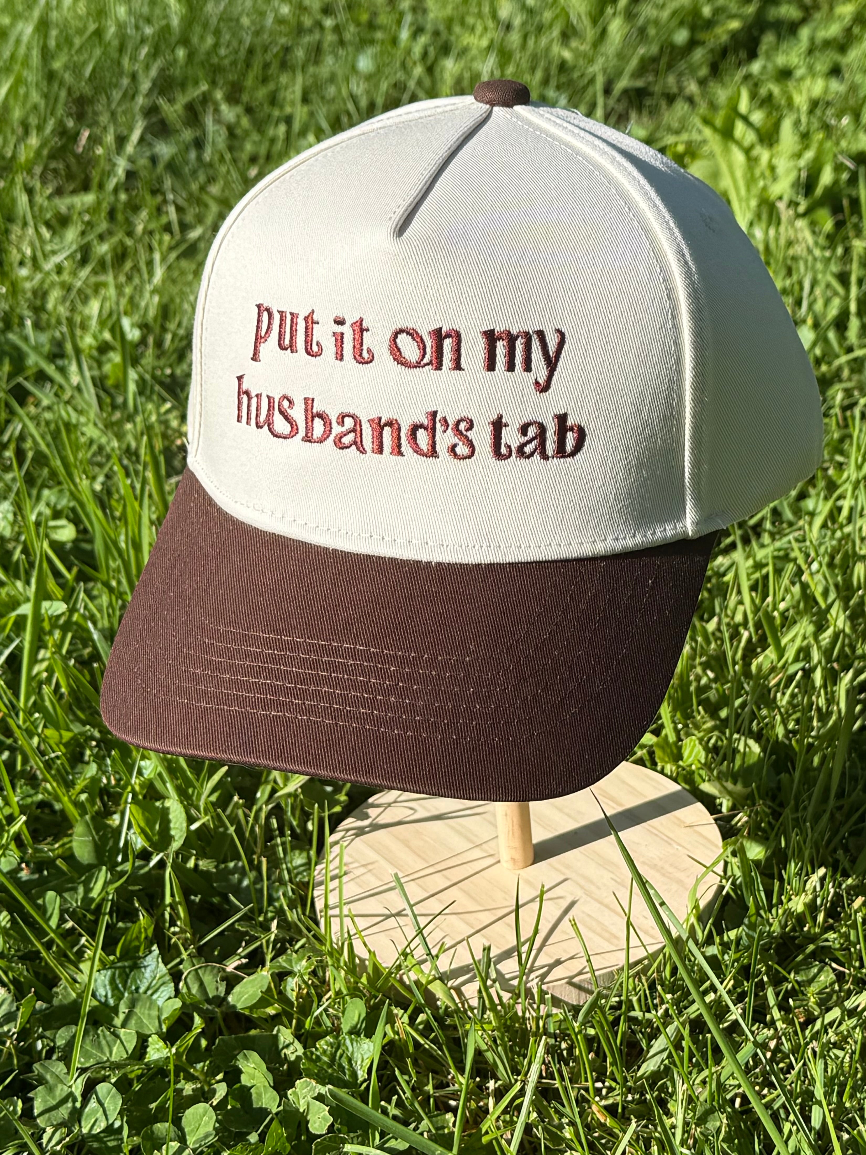 Put it on my husbands tab Trucker Hat